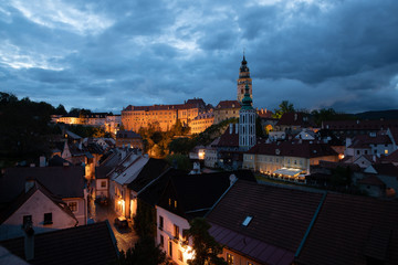 Fototapeta premium Panoramic landscape view of the historic city of Cesky Krumlov during sunset with famous Cesky Krumlov Castle, Church city is on a UNESCO World Heritage Site captured during spring