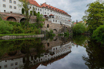 View of the Vltava River and the Church with the Reflection of the Cesky Krumlov River with the Famous Cesky Krumlov Castle, the UNESCO World Heritage Site