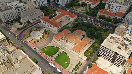 Fototapeta premium Aerial photo of famous landmark buildings of Academy of Athens, Panepistimio and public Library, Athens, Attica, Greece