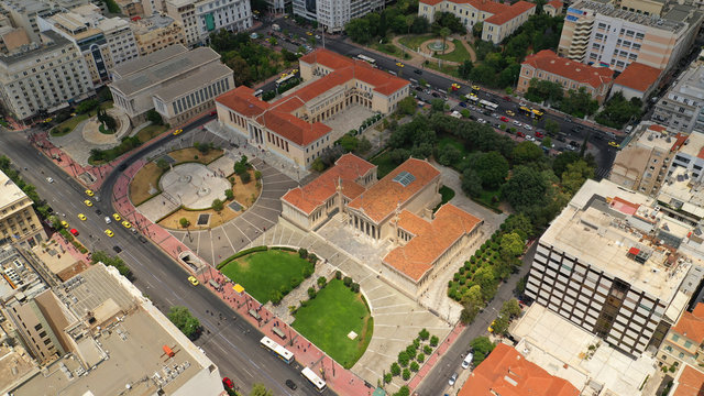 Aerial photo of famous landmark buildings of Academy of Athens, Panepistimio and public Library, Athens, Attica, Greece