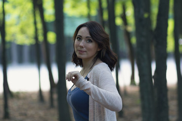 Beautiful woman in the garden with mystical background. People