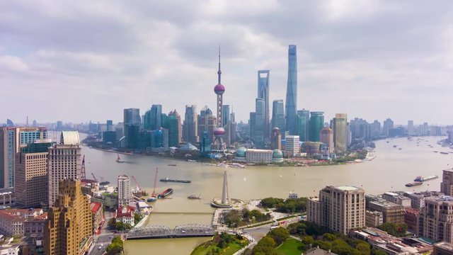Shanghai City. Urban Lujiazui District and Huangpu River. China. Aerial Hyper Lapse, Time Lapse. Drone Flies Forward and Upward