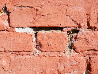 old painted red brick wall