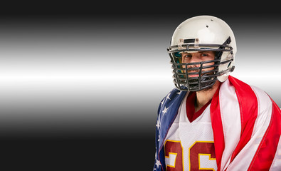 American football concept, portrait of american football player with american flag on black background. Concept patriotism, sport, motivator.