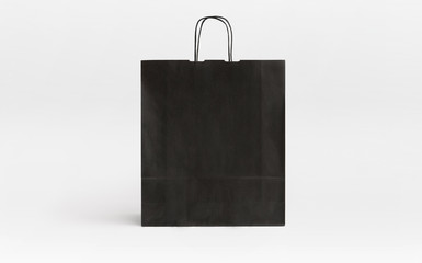 black paper bag with stripes front
