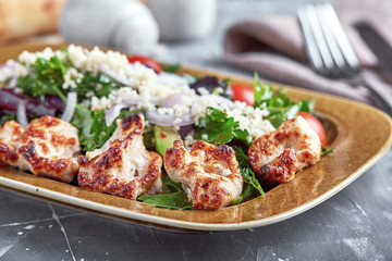 Chicken Salad. Chicken Caesar Salad. Caesar Salad with grilled chicken on plate. Grilled chicken breasts and fresh salad in plate