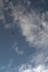 kite in the sky,motorized paraglider,flying,sky, parachute, paragliding, sport, blue,clouds, extreme, adventure, air, 