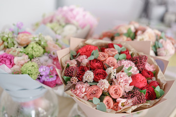 showcase flower shop. Beautiful spring bouquets. Arrangement with mix flowers. Small family business. Work florist. copy space