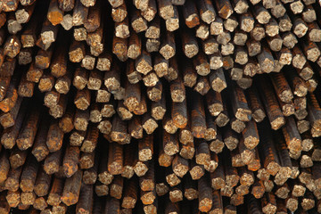 iron grunge background: rough cut rebar profile, short focus