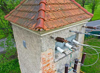 Aerial perspective drone view on the old historical power tower for transferring electric power through air line