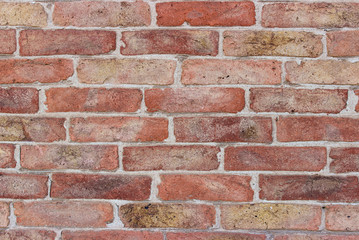 Red-brown old brickwork. A snapshot of the wall of an old brick building