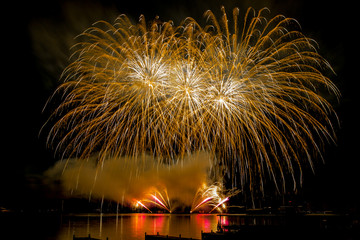 Fireworks fired over the water surface