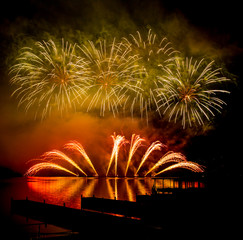 Fireworks fired over the water surface