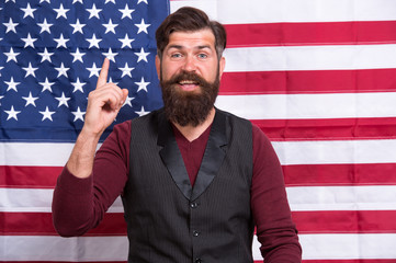 Idea and ideology. Patriotic concept. American lawyer teacher speaker or tv host american flag background. Love homeland. Man with beard and mustache with american flag. Make America great again