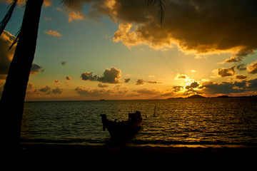Sunrise about sea with boat in Thailand