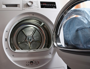 Laundry dryer door open without laundry.