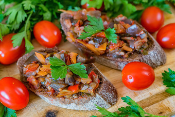 Top view home made aubergine pate or spread on rye bread