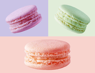 Colorful french cookies macarons set, isolated on colored background. Tasty fruit, almond sweet cookies macarons cakes with focus stacking. Full depth of field. Dessert design elements