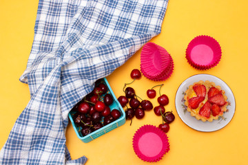 strawberry tart and cherry in basket
