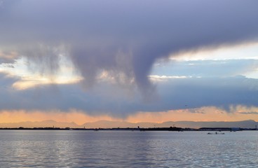 Rain clouds over the lagoon in the area of Venice.