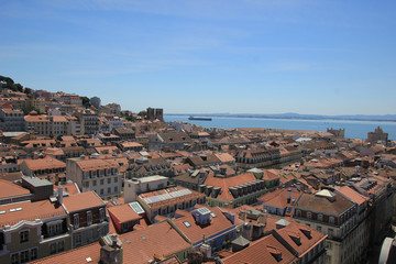 view over the old town alfama of lisbon with the river tejo in the background