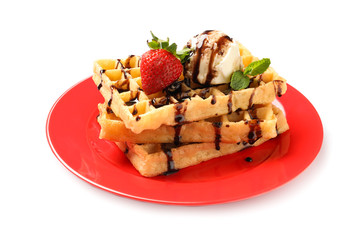 Plate with yummy waffles and ice cream on white background