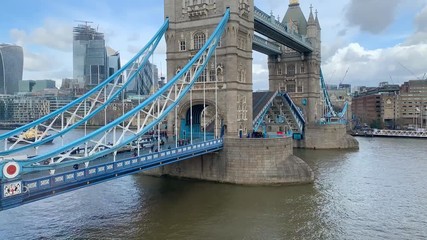 Timelapse of Tower Bridge London opening to let a military ship pass - Powered by Adobe