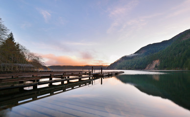 Naklejka na ściany i meble Beautiful sunrise over Lake Crescent at Olympic National Park. The Lake is a deep lake located entirely within Olympic National Park in Clallam County, Washington, USA