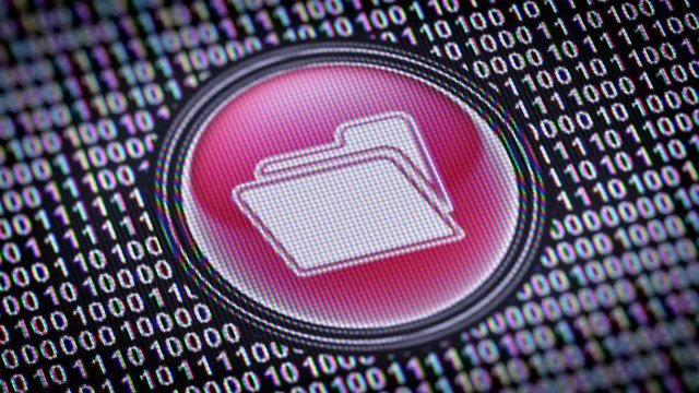 File icon. Binary code ( array of bits ) in the screen. Looping footage with Prores4444.