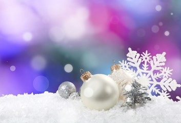 Fototapeta na wymiar Silver christmas balls over snow isolated on white