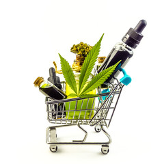 Purchasing Cannabis oil concept, Cannabis CBD oil bottles in miniature shopping cart