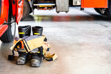 Flame retardant fireman's boots and pants ready to be used in case of emergency.