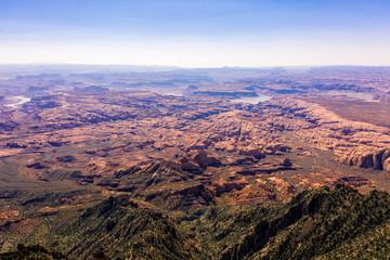 Fototapeta na wymiar Aerial drone photo - Beautiful Henry Mountains in the Utah desert. Lake Powell in the distance. 
