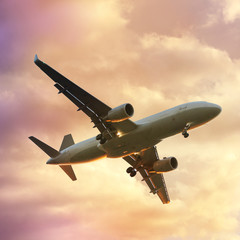 The plane flies on a journey towards the bright light in the sky, square