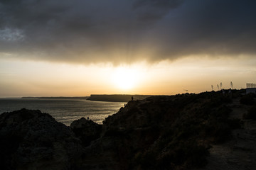 The last bit of sunlight over Portugal's cliffside Atlantic coast