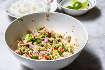 Spicy Beaf Salad with Lemongrass with rice and lemon on table. Thai Food Menu Style.