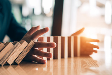 young beautiful businesswoman smiling playing and building wooden at the office, investment concept