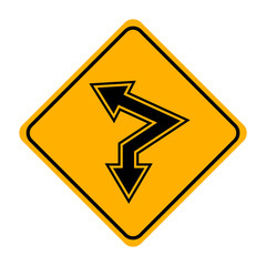 arrow road sign in yellow signage