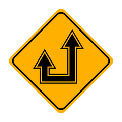arrow road sign in yellow signage