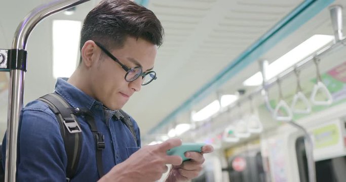 man play games with phone