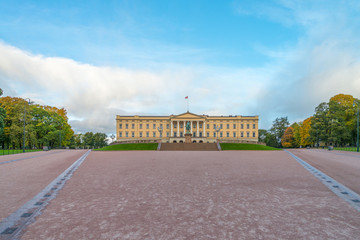 Front view of the Royal Palace  and The equestrian statue of King Karl III Johan of Norway and Sweden stand in front of and blue sky in morning summer. Oslo, Norway. - 272740506
