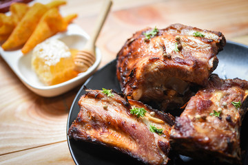 bbq pork ribs grilled with  honey sweet sauce and herbs spices served on the table - Roasted barbecue pork spare rib sliced