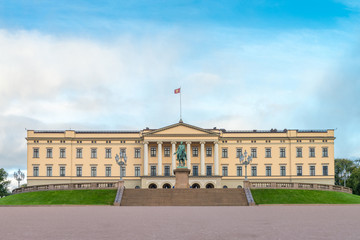 Front view of the Royal Palace  and The equestrian statue of King Karl III Johan of Norway and Sweden stand in front of and blue sky in morning summer. Oslo, Norway. - 272740522