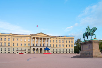 The equestrian statue of King Karl III Johan of Norway and Sweden stand in front of the Royal Palace with blue sky in morning summer. Oslo, Norway.  Text translation: The love of the people my reward. - 272740569
