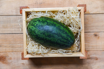 Fresh watermelon on wooden box - top view - harvest watermelon summer fruit