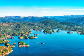 Beautiful aerial view of fjord landscape with small village  and ferry on the ocean near Bergen, Norway - 272740793