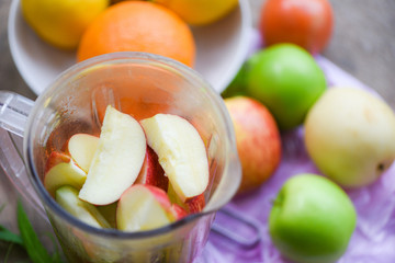 Fruit Smoothie / Fresh fruit slice in the blender preparing healthy juice summer ingredients