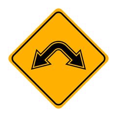 arrow road sign in yellow signage