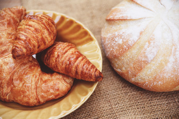 freshly baked croissants - Bakery bread on sack in the table homemade breakfast food concept