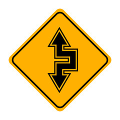 arrow road sign in yellow signage